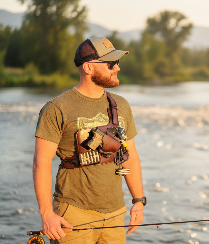 Man in outdoor setting with trees and clear sky